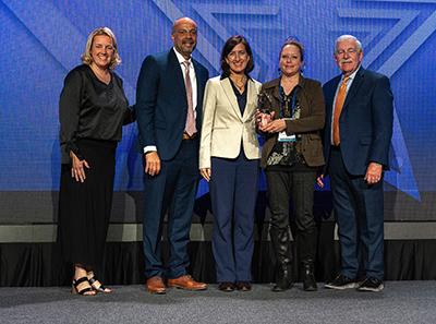 Photo: Nancy Daubenberger and Jennifer Wells accept the 2023 State IT Recognition Award.